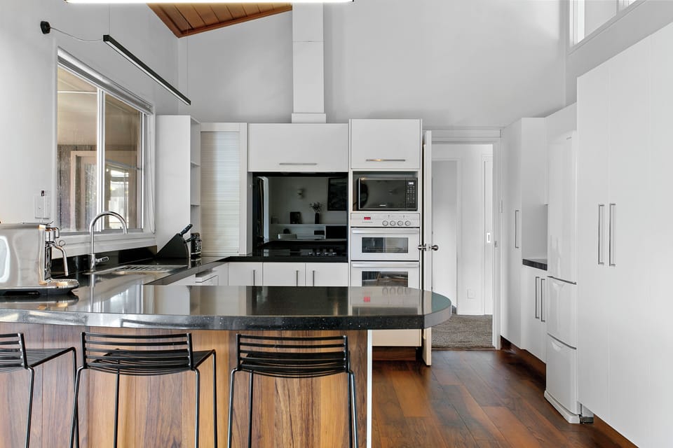 Large Kitchen area with Nespresso machine, water dispensing fridge and 2 ovens
