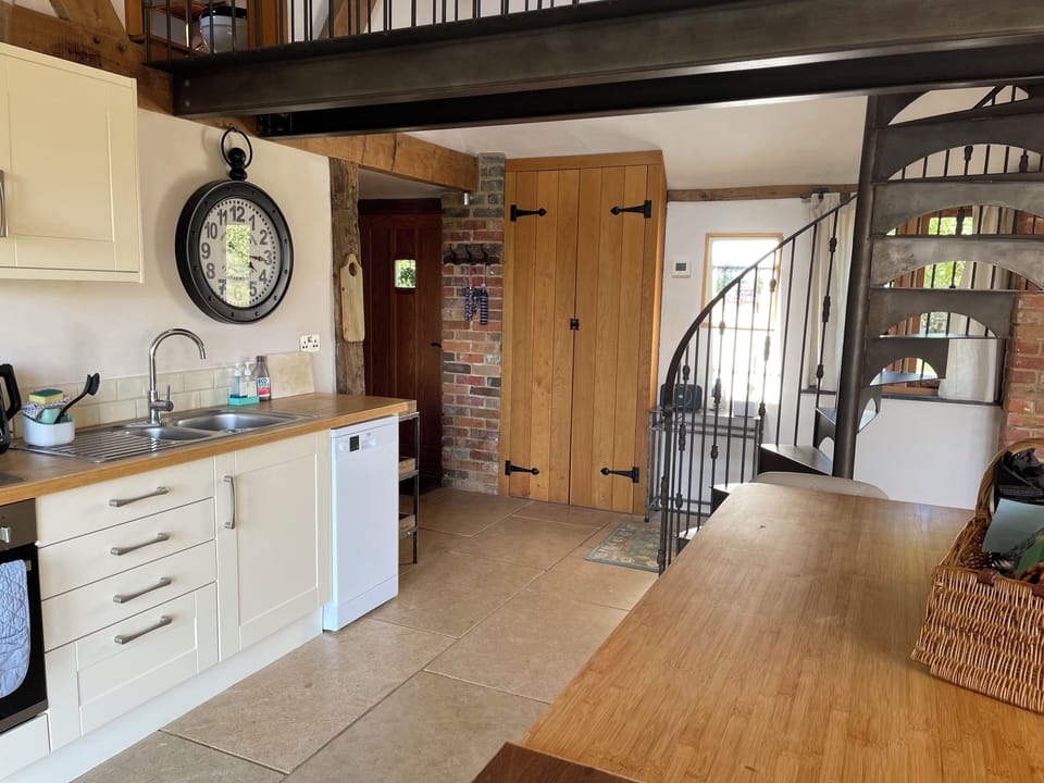 Kitchen and 'bridge' which connects upstairs bedroom and bathroom