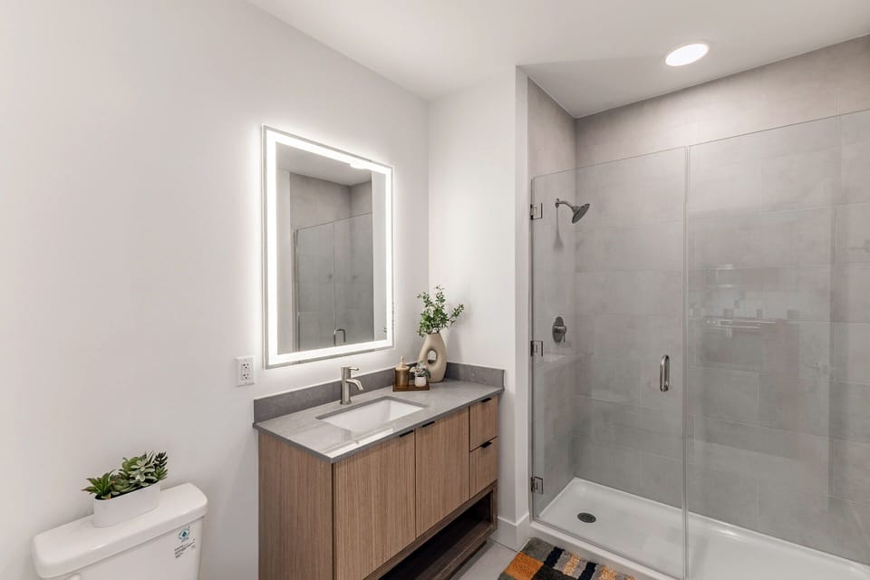 Refresh in the spa-like bath with glass shower.