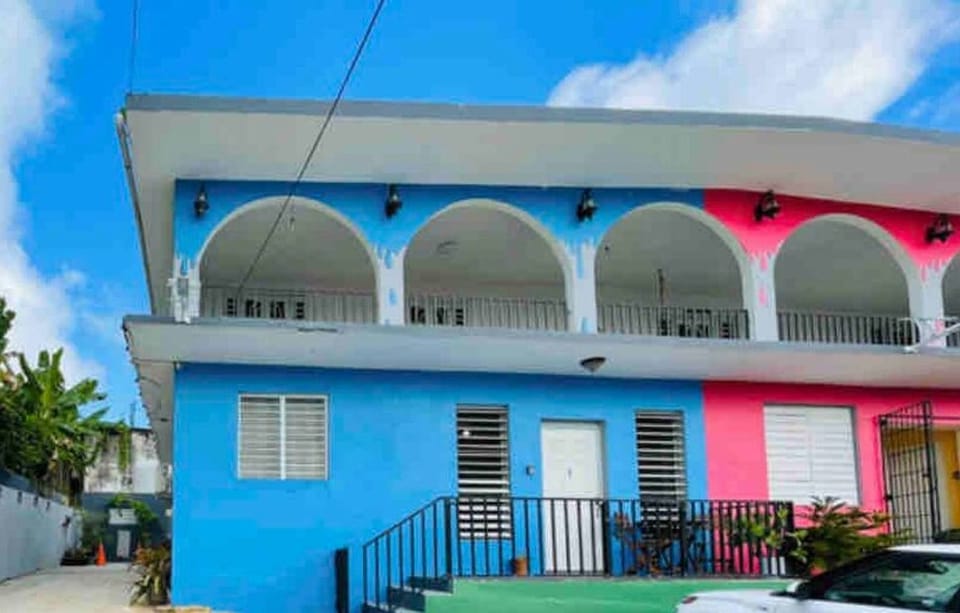 Step into your inviting retreat! Our vibrant house entrance leads directly to your private Apartment 4, promising a warm welcome to your Caribbean escape.