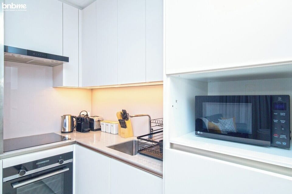 Kitchen: "Prepare delicious meals in our fully-equipped kitchen, complete with modern appliances for your culinary needs."