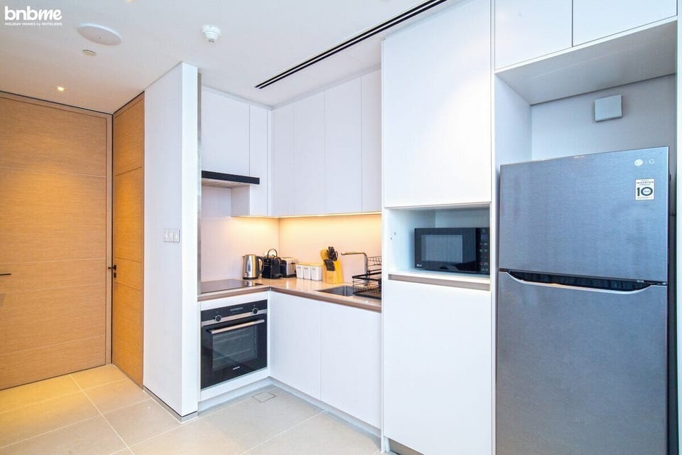 Kitchen: "Prepare delicious meals in our fully-equipped kitchen, complete with modern appliances for your culinary needs."
