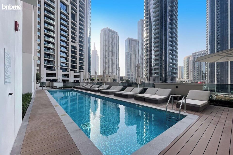 Public Pool: "Escape the city heat and unwind in our inviting public pool, offering a refreshing oasis with stunning views for guests to enjoy."
