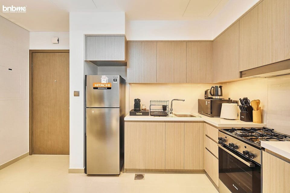 Kitchen: "Prepare delicious meals in our fully-equipped kitchen, complete with modern appliances for your culinary needs."