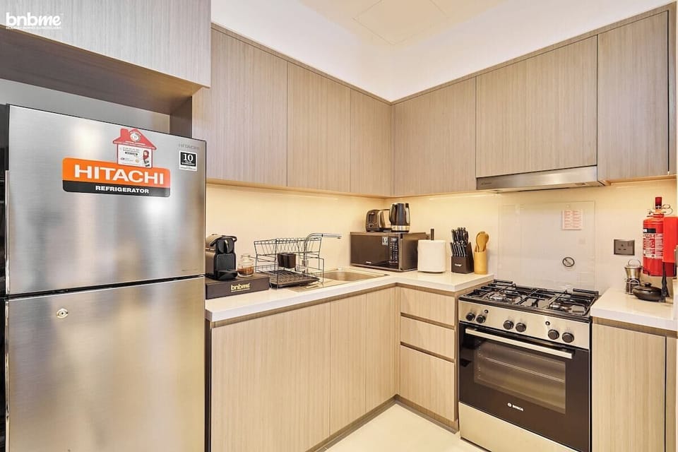 Kitchen: "Prepare delicious meals in our fully-equipped kitchen, complete with modern appliances for your culinary needs."
