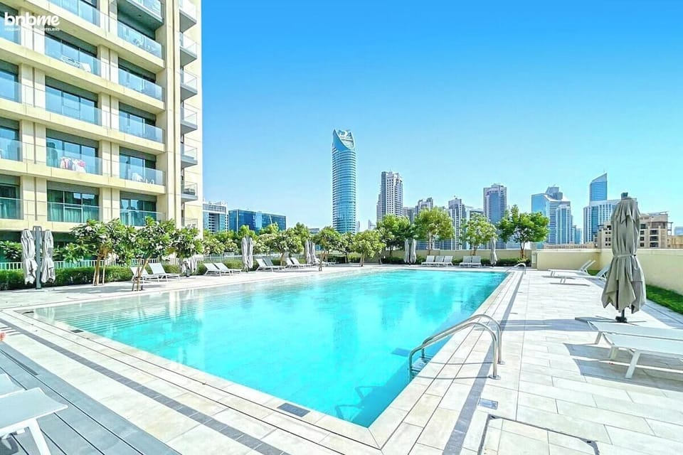Public Pool: "Cool off and enjoy city views at our refreshing public pool, a perfect spot for relaxation."