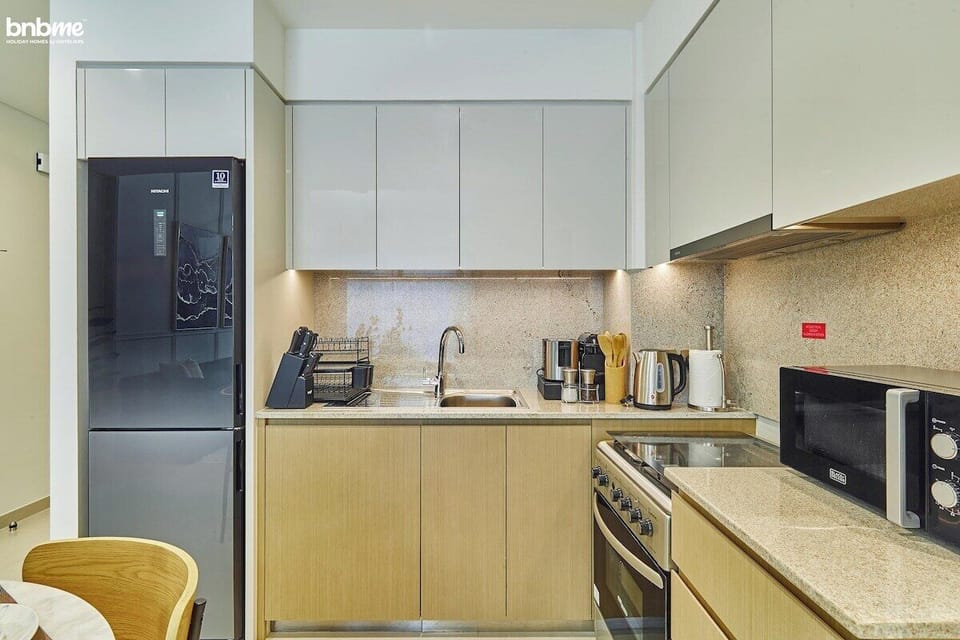 Kitchen: "Prepare delicious meals in our fully-equipped kitchen, complete with modern appliances for your culinary needs."