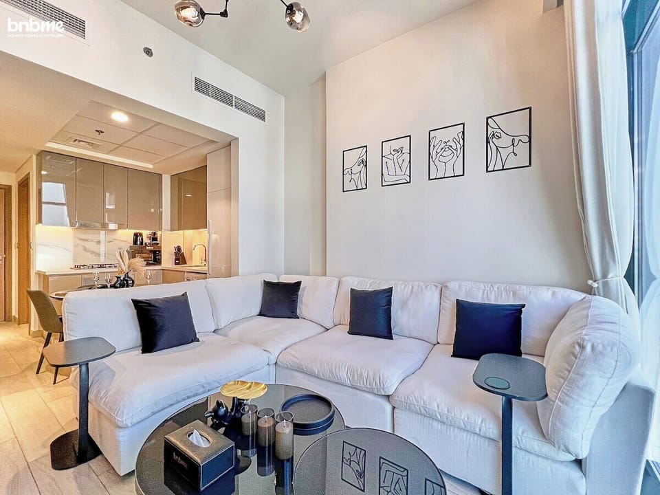 A bright and inviting living space with direct access to the balcony—perfect for relaxing after a day of exploring.