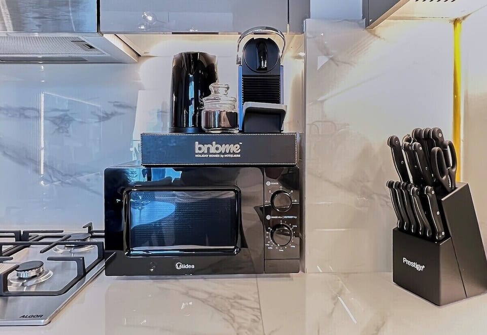 Sleek countertops, premium appliances, and all the essentials—this kitchen is ready for your culinary creations.