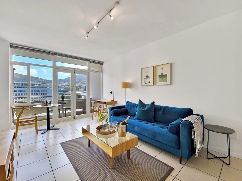 Open, light, bright living room with comfy sofa