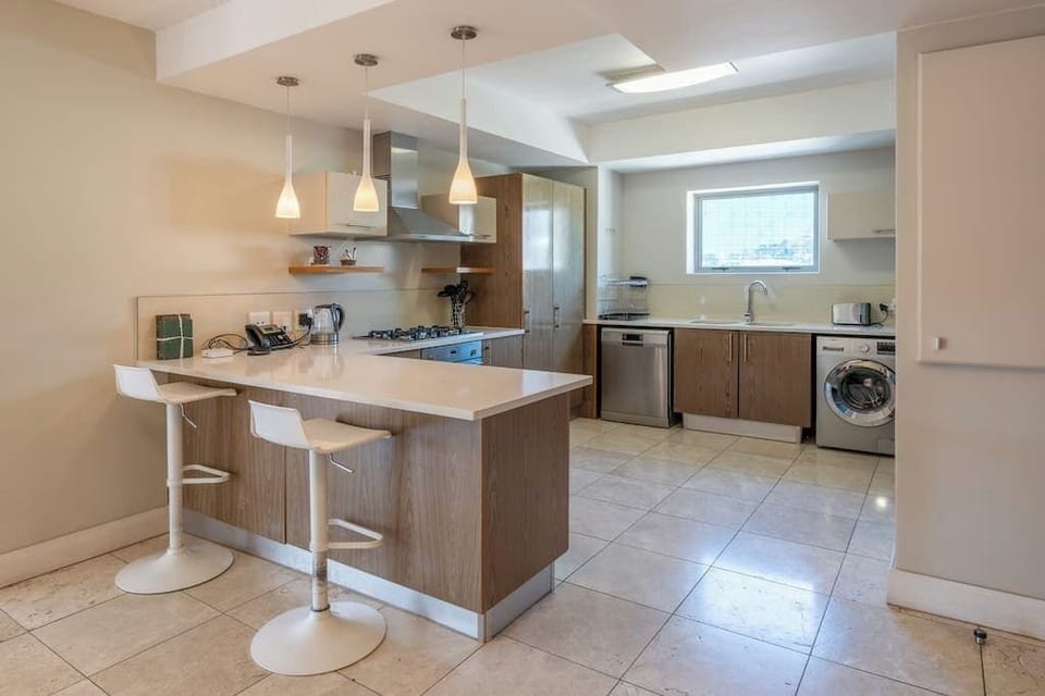 Kitchen counter with two high chairs