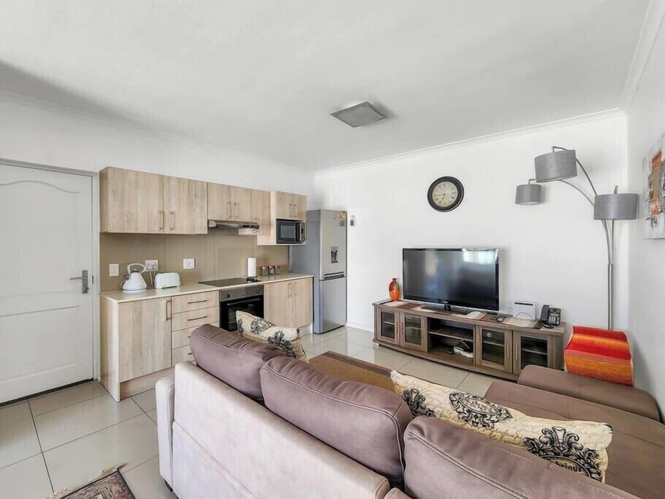 Living room area leading to kitchen