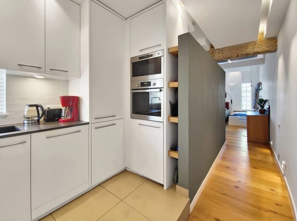 Kitchen leading to dining and living room