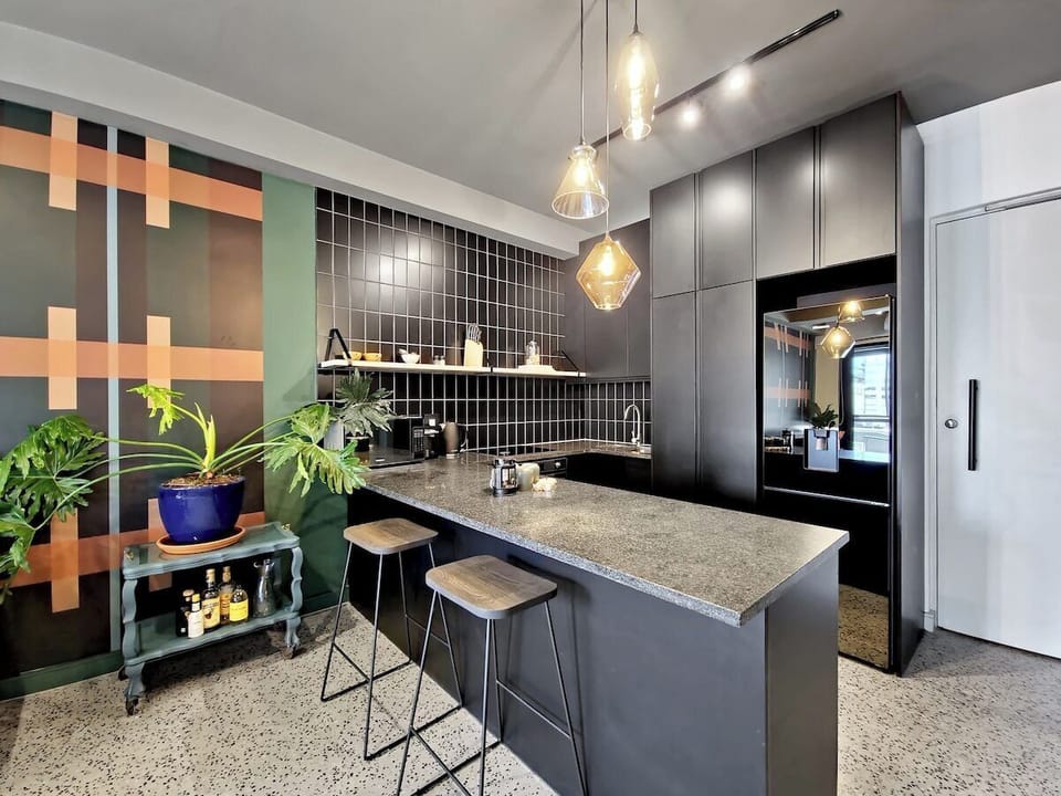 Kitchen with all new appliances, Smeg stove top and washing machine for your laundry needs