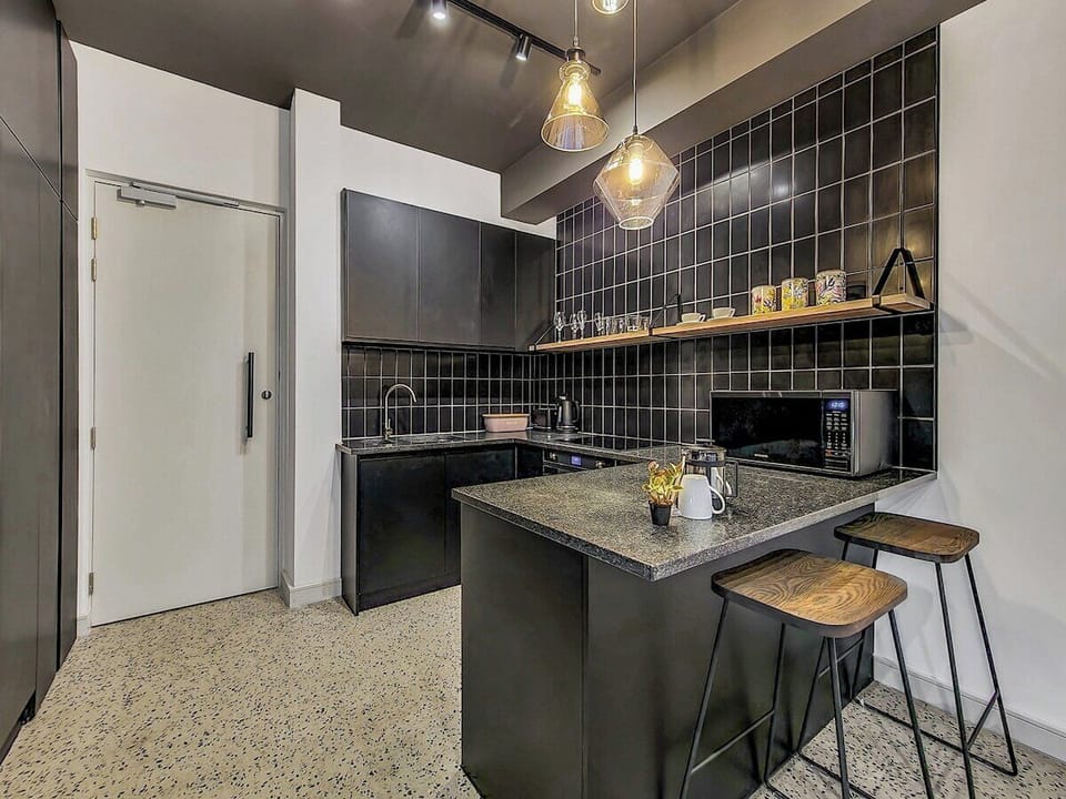 Kitchen with lots of storage space and washing machine