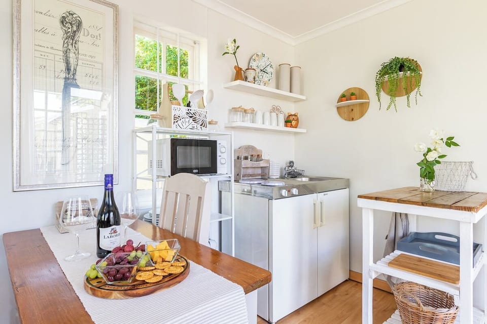 Compact kitchenette with essentials and dining table