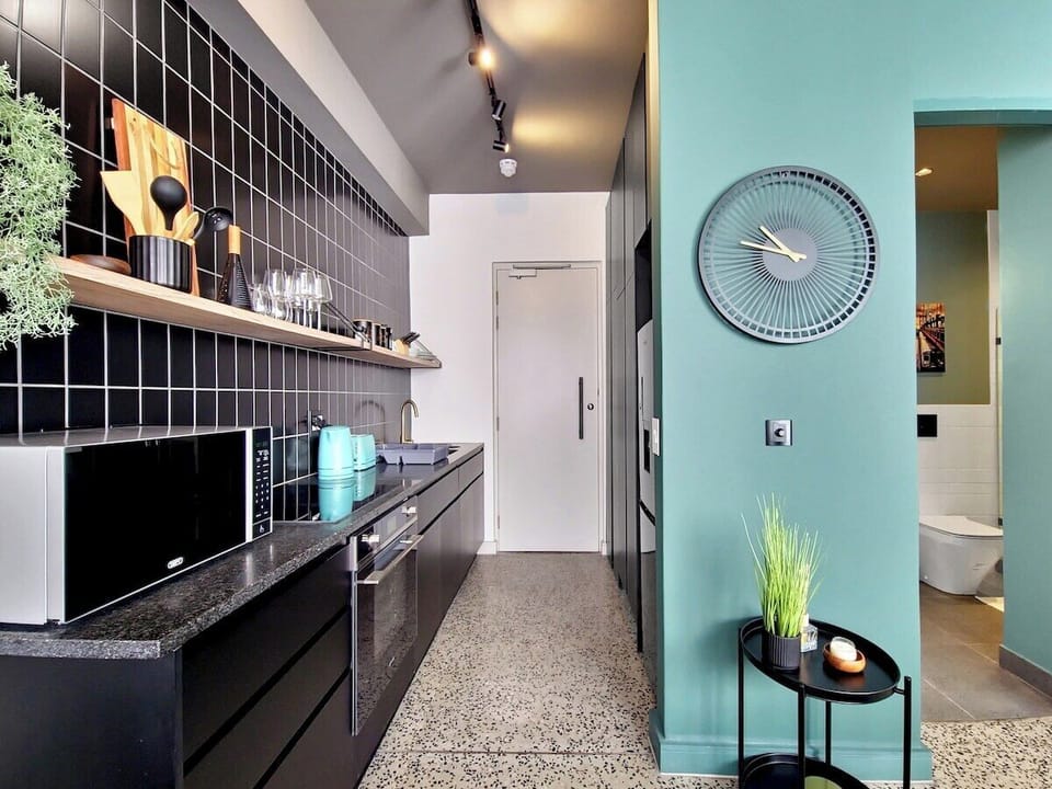 Kitchen leads out to the living room and bedroom