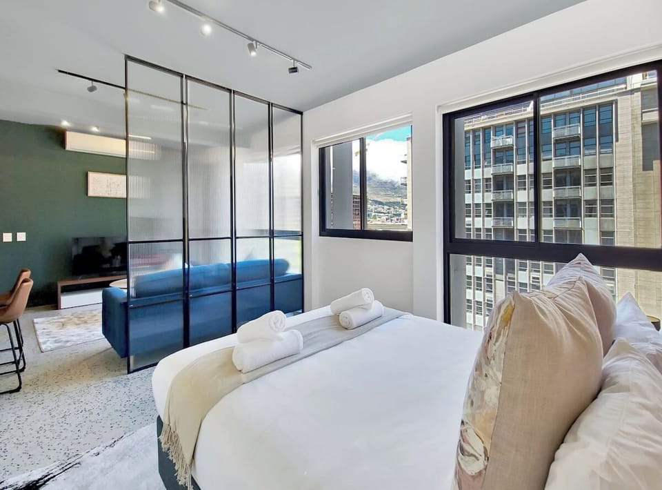 Glass partition to separate the bedroom from living room area