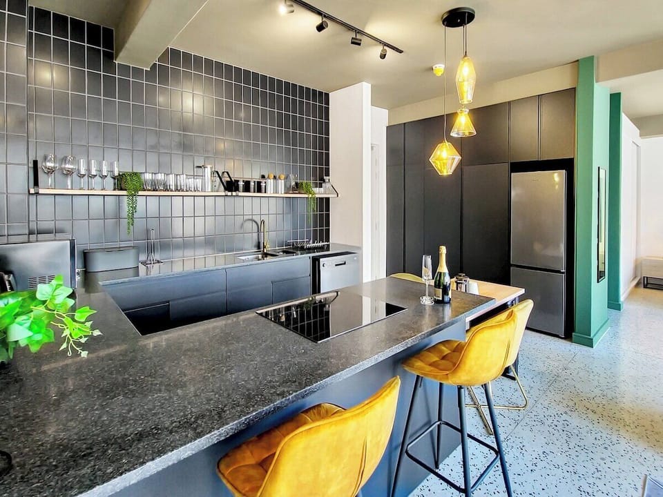 Seating at the counter to keep conversation flowing while the chef whips up a home cooked meal to enjoy