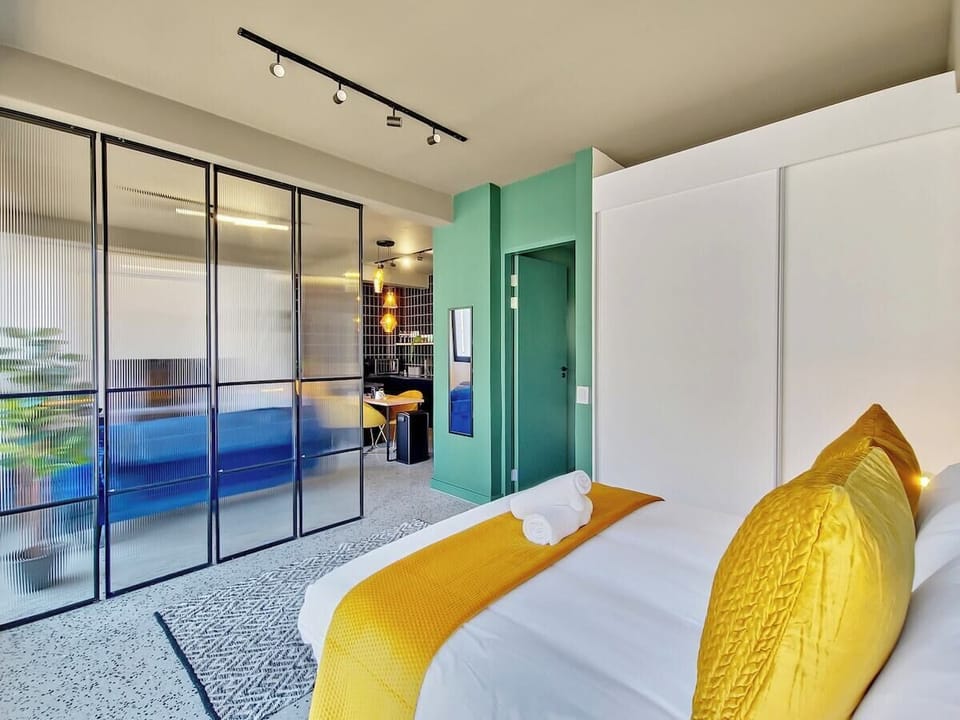 Glass partition separating the living room from the bedroom