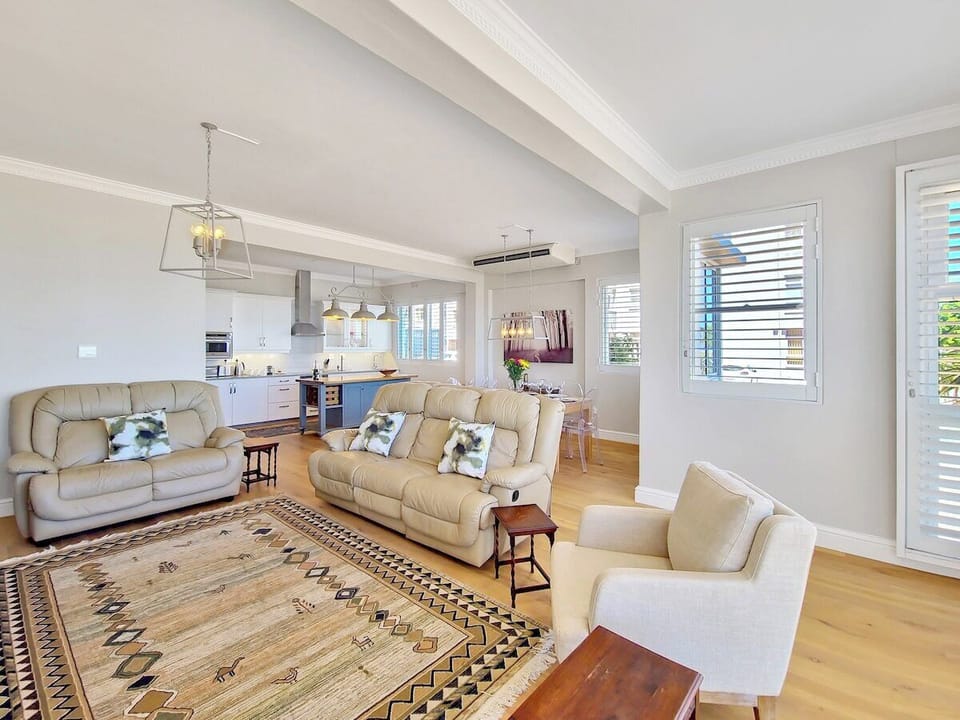 Loads of natural light streams into the living and dining room areas from the large bay style windows