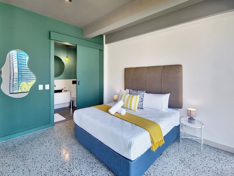 Bedroom area flows into the en-suite bathroom