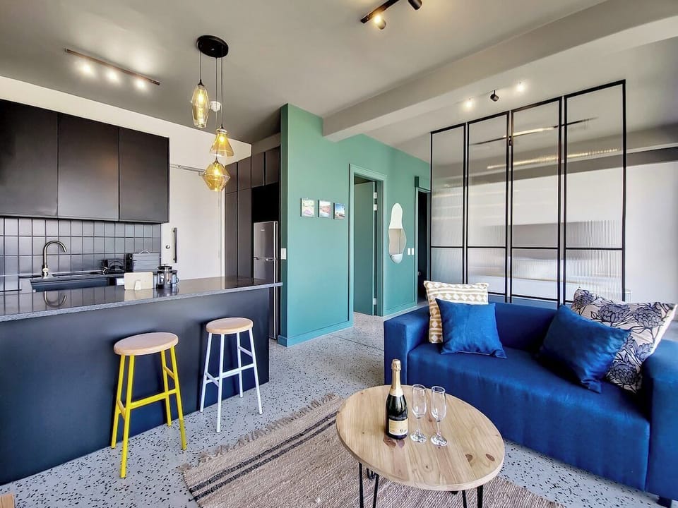 Walk in closet on the left for all your cupboard storage you could need, open plan seating area at the counter