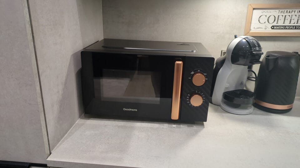 Apartment 25 - Fully equipped kitchen with oven, microwave, fridge-freezer, washer and all essential cookware.  With a quiet street view.