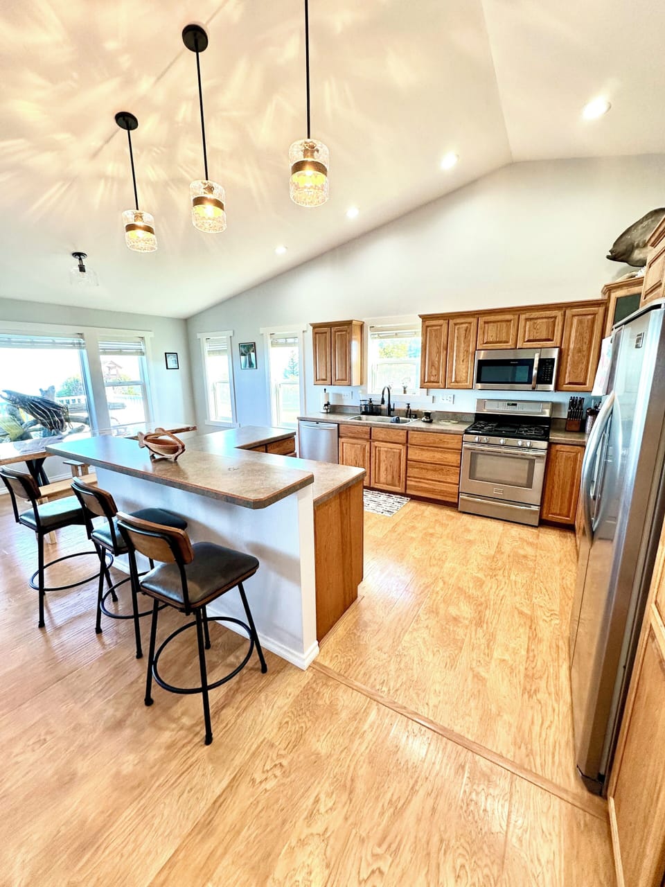kitchen with dishwasher, full refrigerator and range with oven.