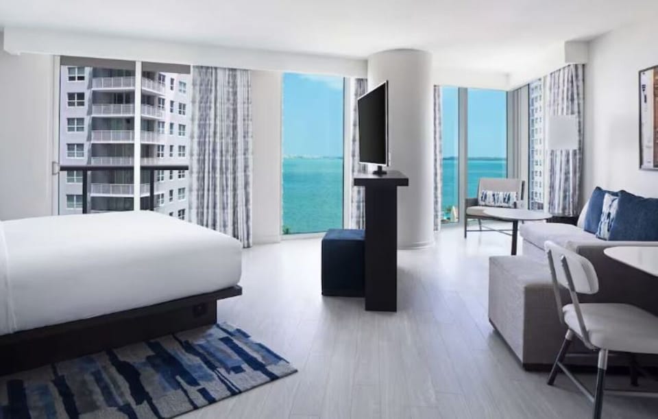 Wake up to sweeping bay views in a bright suite.