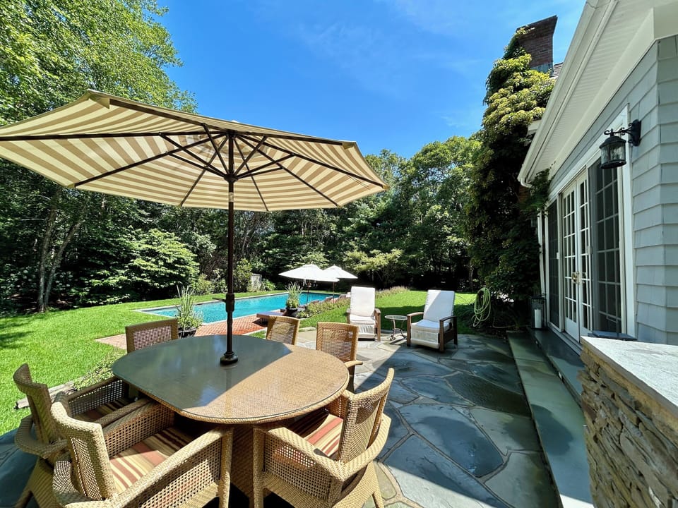 Outdoor dining seats 6. 2 recliners on above patio. Grill and refrigeration.