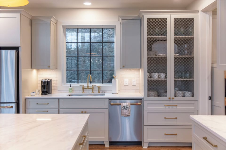 Fully equipped kitchen with GE Cafe appliances & large island for entertaining.