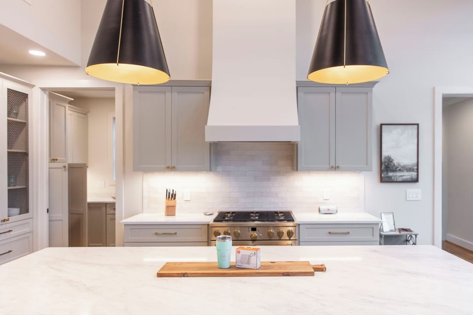 Fully equipped kitchen with GE Cafe appliances & large island for entertaining.