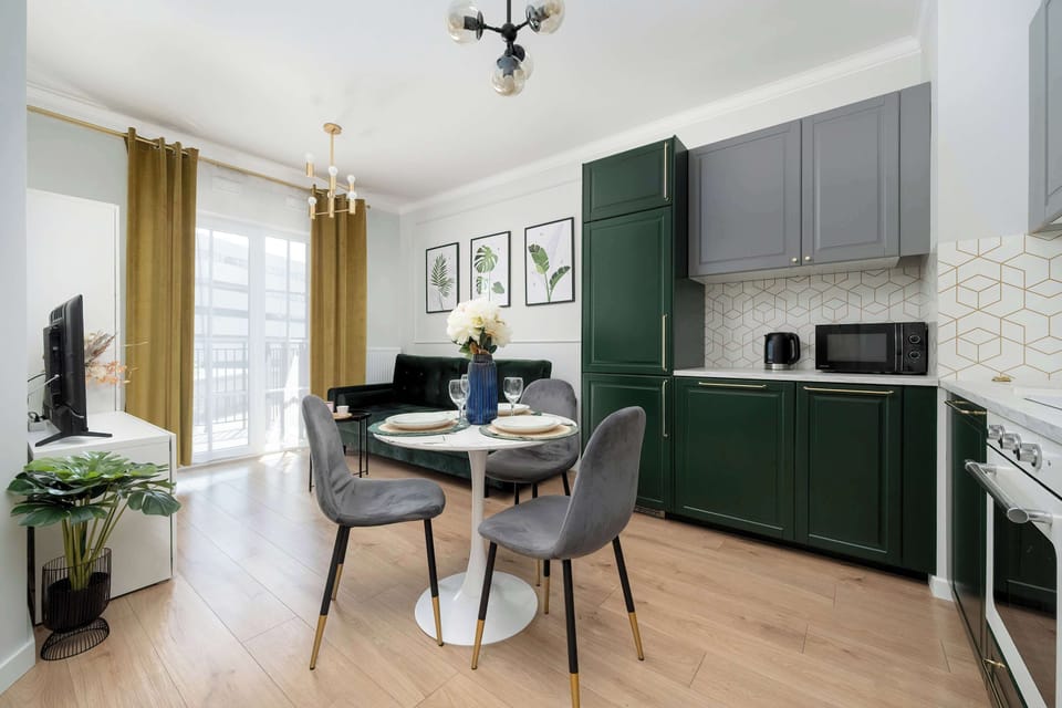 The elegant living room featuring a double sofa bed, perfect for relaxing or sleeping.