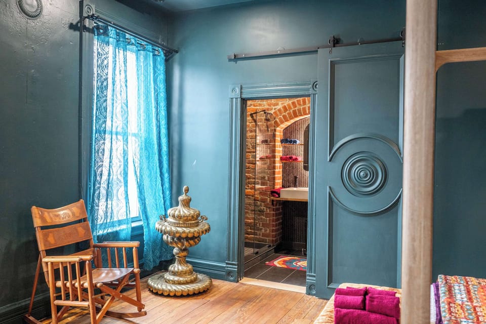 Eclectic king suite with ensuite bath & oversized screen for cozy movie nights​