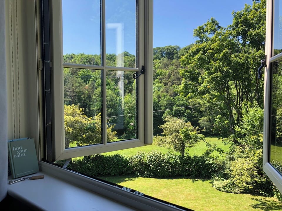Wonderful uninterrupted views from the French windows to the Woods opposite