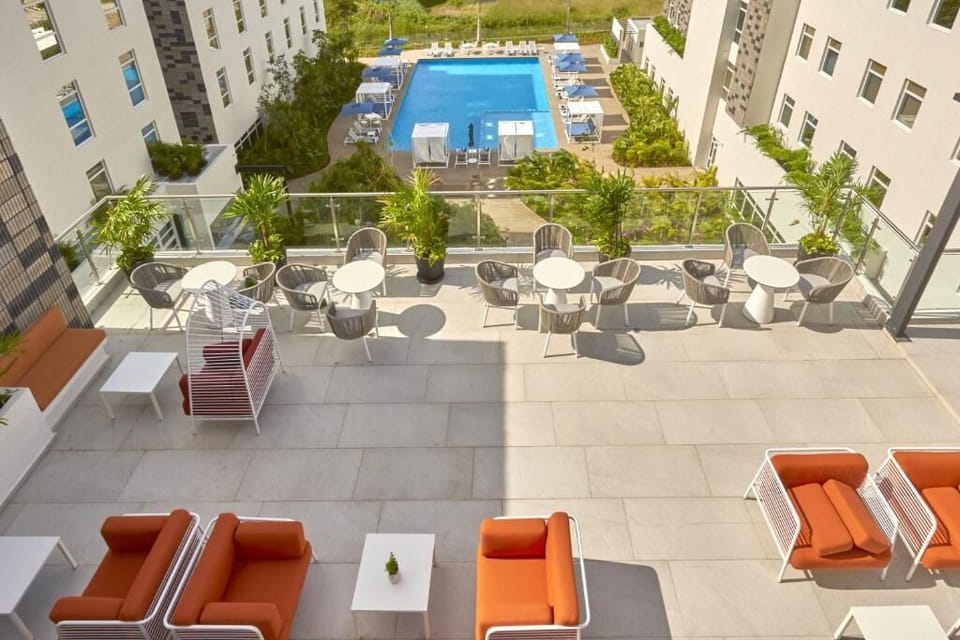 Unwind above it all with sunset drinks and pool views.