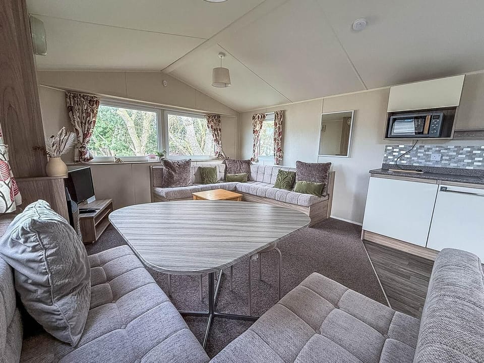 The living room in your caravan at Broadland Sands Holiday Park Lowestoft is a cosy haven, perfect for relaxing after a day of seaside fun at Lowestoft beach Suffolk.
