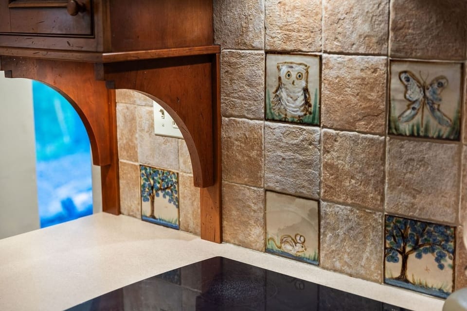 Whimsical artisanal tile - a detail to make you smile.