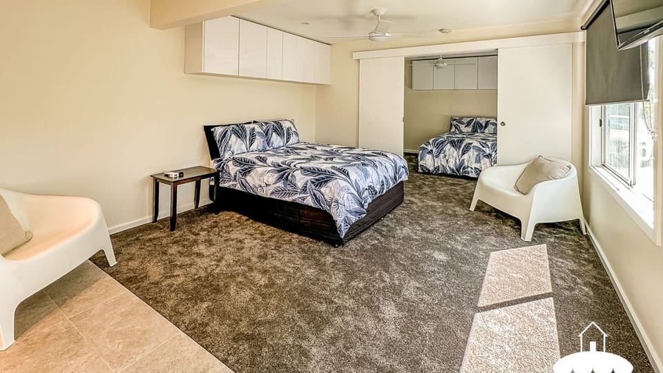 Downstairs bedrooms separated by sliding doors