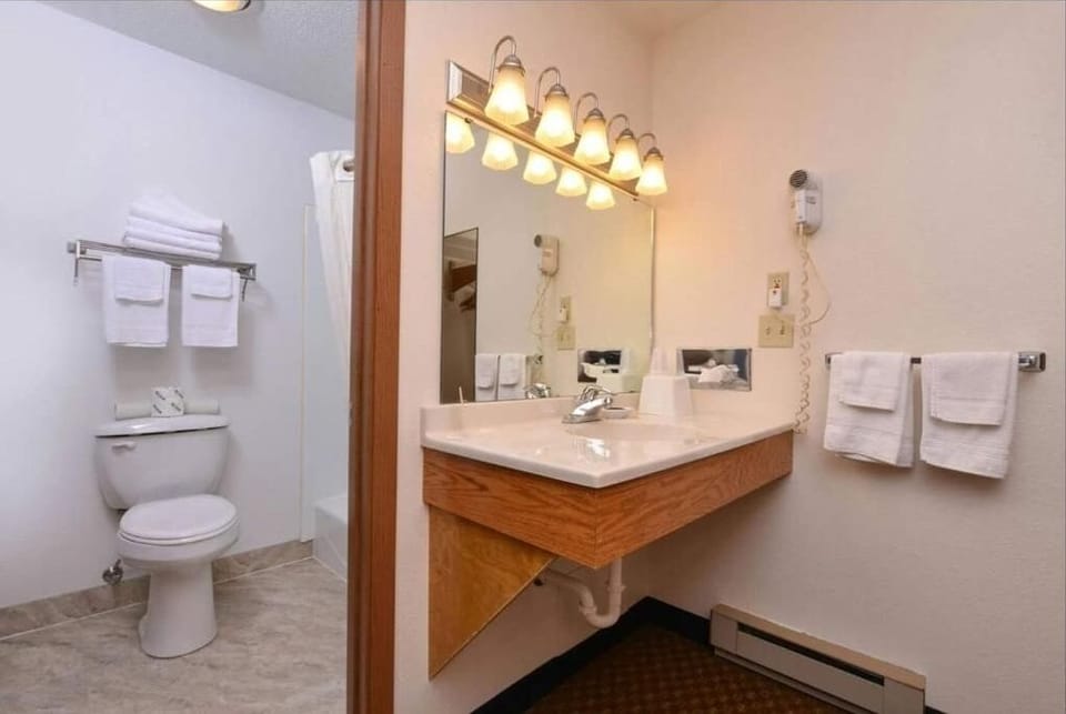 Get ready easily with a bright vanity and generous mirror.