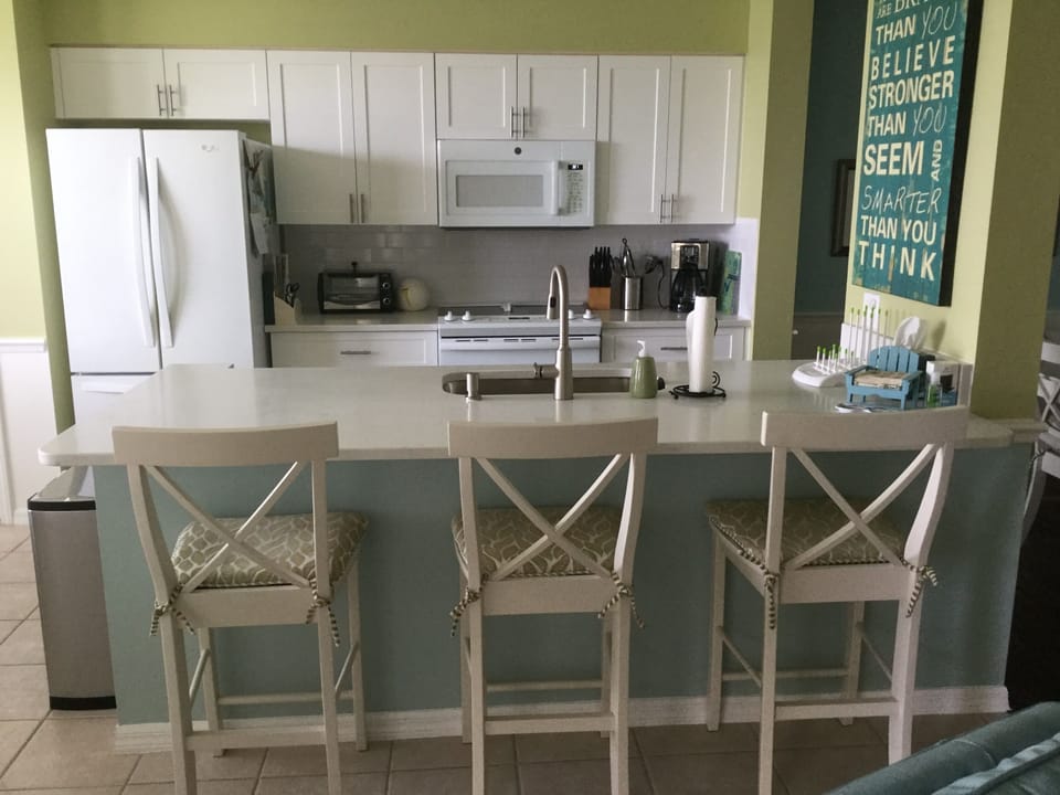 Kitchen with counter height Quartz and extra seating.

