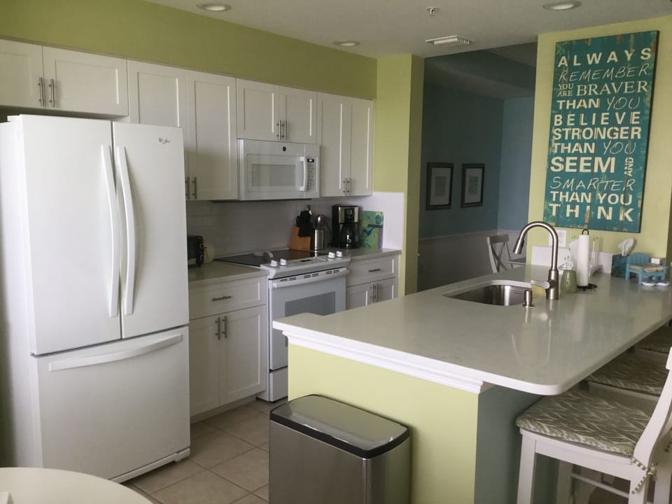 All appliances are updated and white.