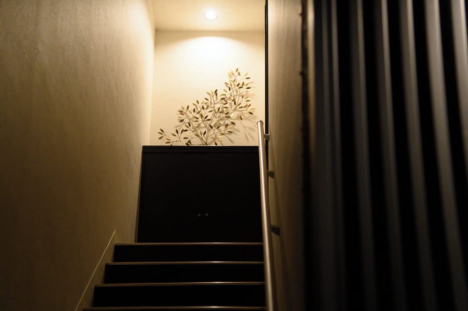 The stairs are just inside the entrance.