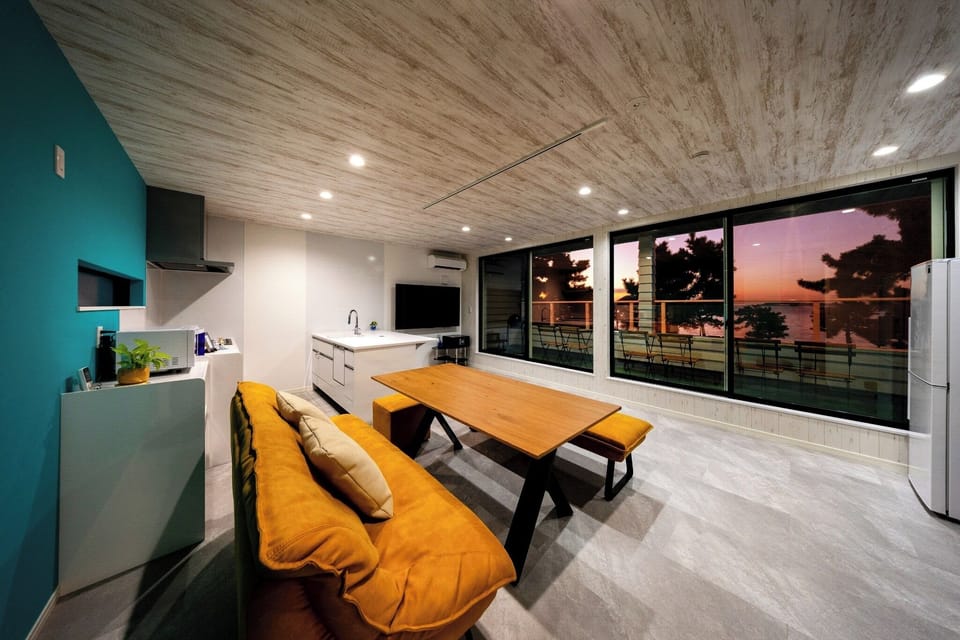 Relax and unwind in the living room as the setting sun shines in.
