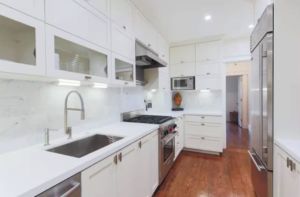 Kitchen is a chef's dream with high end appliances by Sub-Zero, Miele, and Wolf.