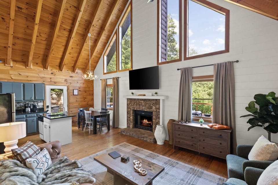 Welcome to our open floor plan with high ceilings, where everything flows seamlessly — from the cozy living room to the kitchen and dining area. It’s all connected, making it perfect for gathering, lounging, and memory-making!