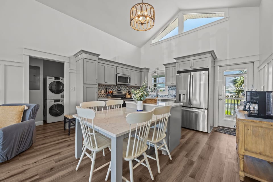 Fully equipped kitchen featuring updated stainless-steel appliances.