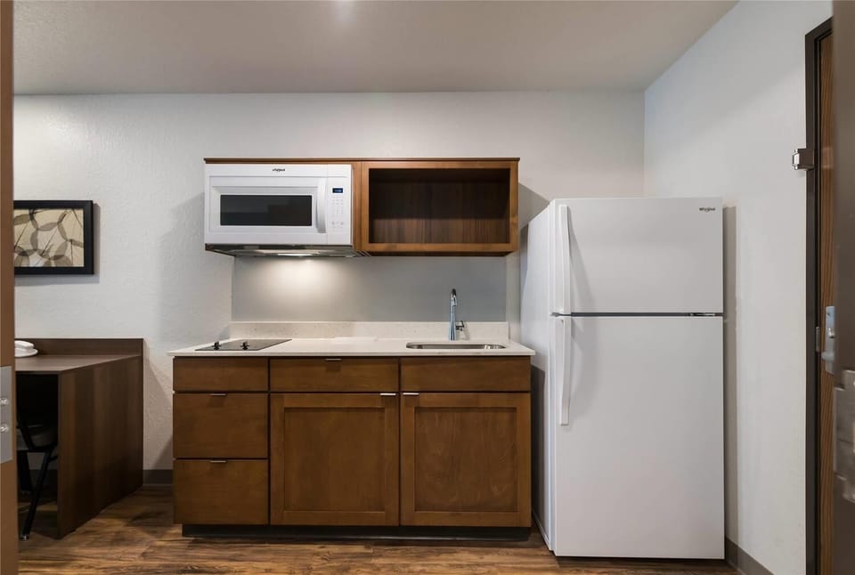 Cook simple meals easily with fridge, sink, and microwave.