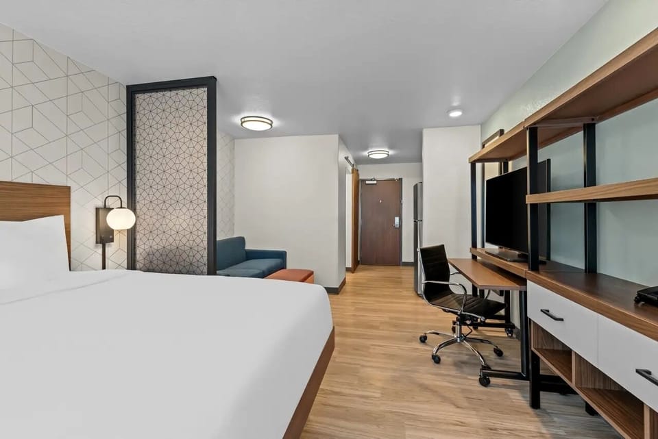 Work comfortably at the oversized desk, then relax nearby.